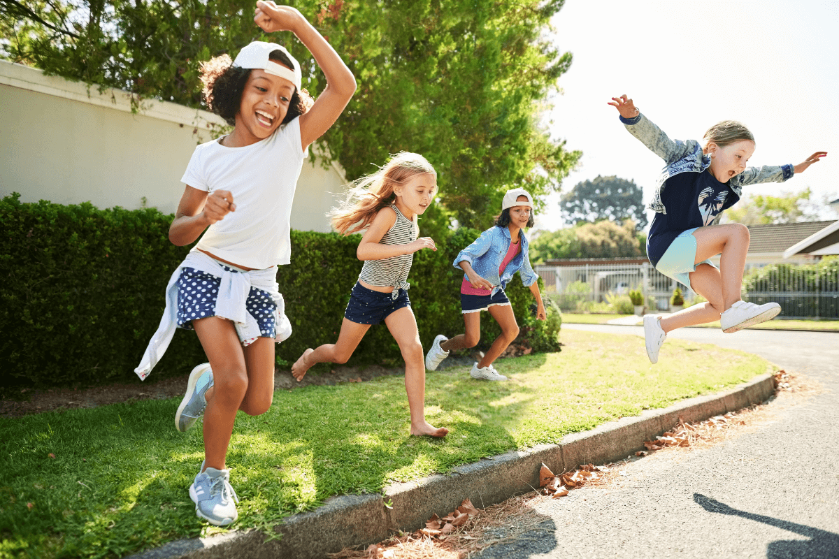 Children jumping as an outdoor sensory activity